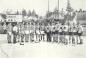 The Canadian and American hockey team lining up on the ice prior to the Gold Medal Game in 1932.