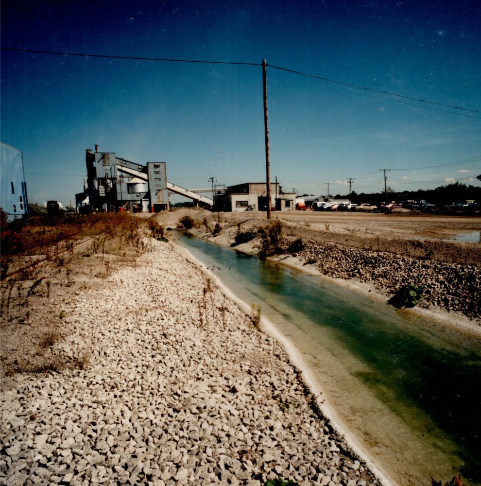 Colour image of water pumped out of quarry pits