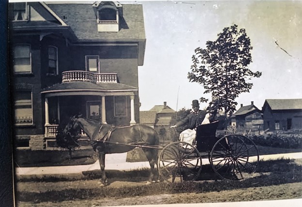 Black and white photograph of Dr. Hanly with his horse and buggy on Church Street in Almonte.