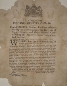 Broadside proclamation to the Province of Upper Canada announcing the war has begun. Paper is brown and foxed with three torn corners.