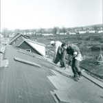 Co-op builders shingling the houses along Lakeside Drive in the early part of the build.