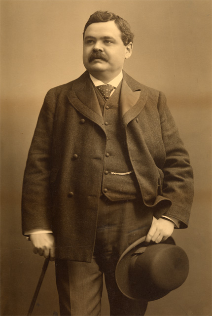 Black and white photo of Lomer Gouin holding his hat.