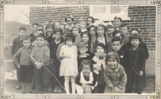 Black and white photo of a group of young children.