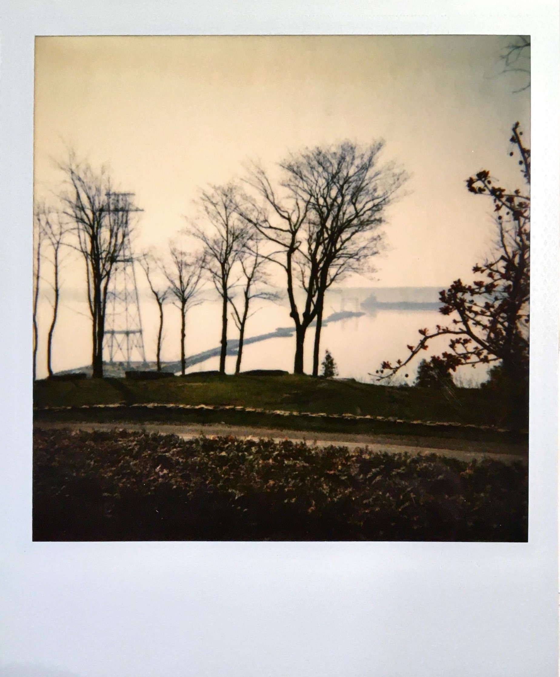 "Polaroid” photo of the river. Here we see the first pylon built near the river bank and a temporary path leading to the middle of the river.