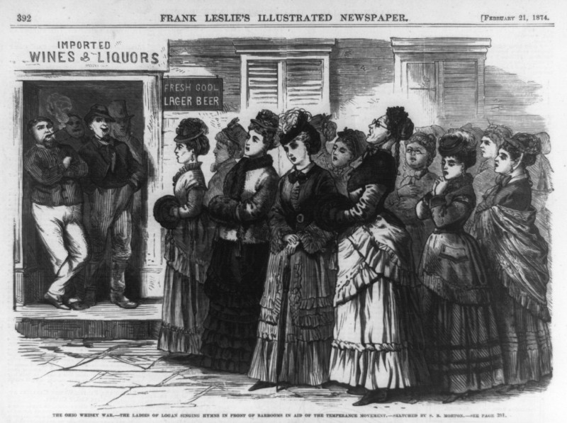 The cartoon shows a group of women waiting for their husbands outside a liquor store.