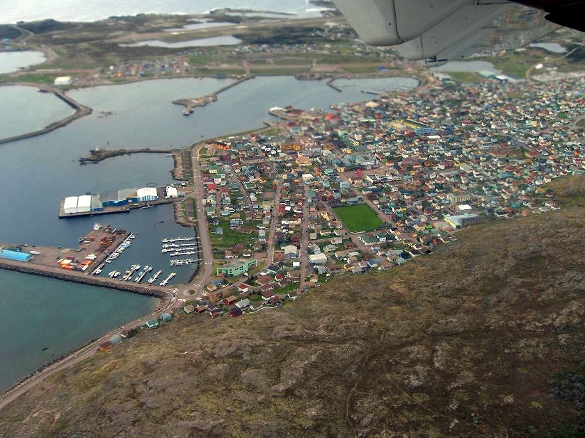 At left are boats at anchor in Saint-Pierre-et-Miquelon’s harbour. On the right, the coastal village founded by this French overseas community.