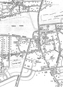 Black and white aerial map of Wabana including locations for a new school, hospital, and centre.