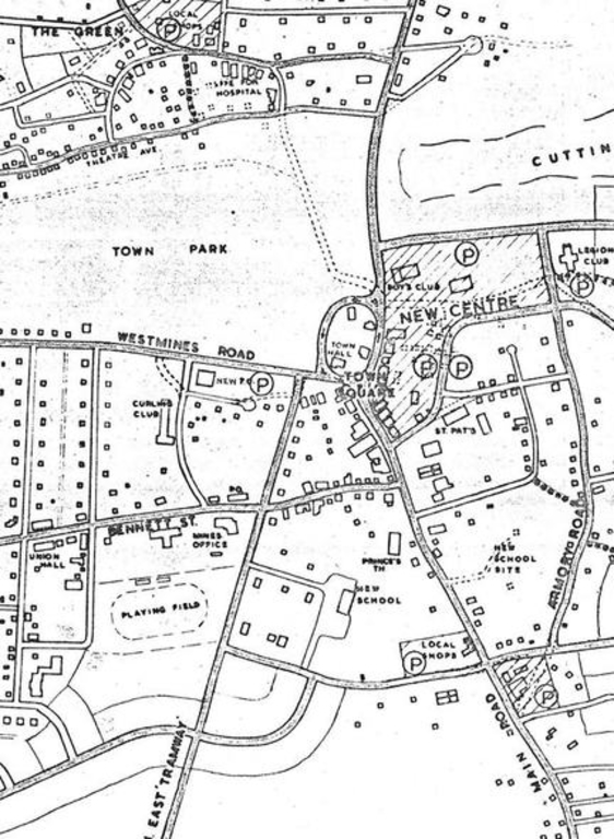 Black and white aerial map of Wabana including locations for a new school, hospital, and centre.