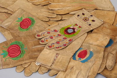 Pile of embroidered leather gloves