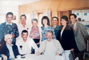 Group of 10 sitting and standing in a room