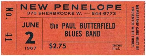 Concert ticket printed on orange paper, featuring name of band, venue and concert date.