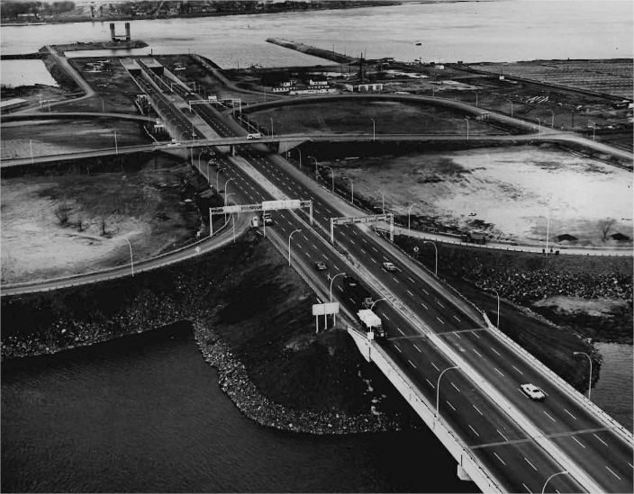 Cars on a highway with a river in the background