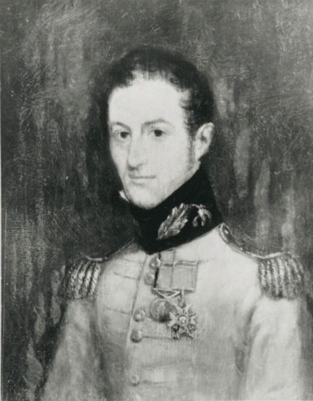 Black and white portrait of a man wearing a British military uniform adorned with two medals.