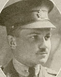 Portrait of a soldier wearing a peak hat. He has a moustache.