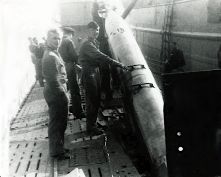 Loading a torpedo into U-518 | When World War II Came to Bell Island ...