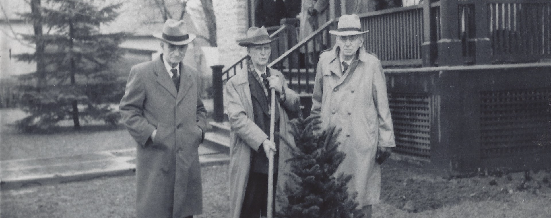 Black and white photograph of Dr. Dunn, Dr. Metcalfe and Dr. Kelly in front of the Rosamond Memorial Hospital during a tree planting ceremony on April 25, 1953.